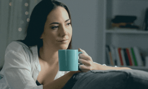 Woman drinking coffee thinking